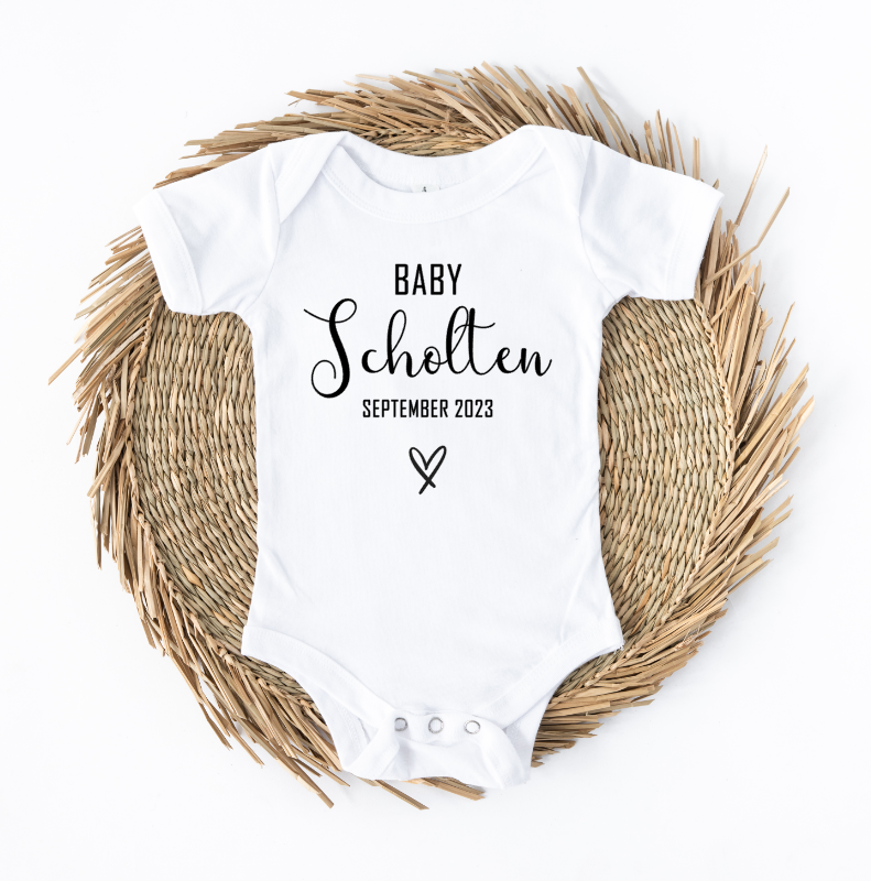Gepersonaliseerde babyromper om een zwangerschap bekend te maken